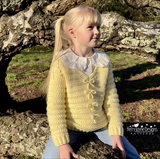 Girl modelling a chunky jumper with bows