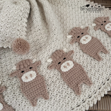 close ip photo of the highland cow blanket pattern 