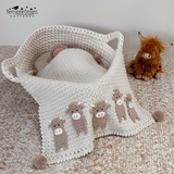  a baby crochet blanket with Highland Cow appliques sewn across the bottom 