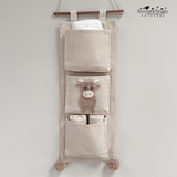 Highland cow applique shown sewn onto a nursery organiser 