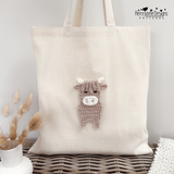 Highland cow applique show sewn onto a tote bag