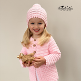 A little model wearing a crochet cardigan by Kerry Jayne Designs 