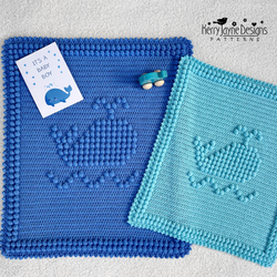 A blue and turquoise whale blanket 