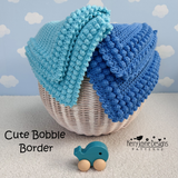 Two blue crocheted blankets on a basket