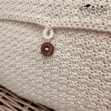 Crocheted cushion with four tassels and a button closure at the back, a crochet pattern by Kerry Jayne Designs 
