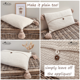 A four-panel collage showing a crocheted rectangular throw pillow in a warm cream/off-white color, styled on a woven wicker surface. The pillow has tassel ends and a small wooden button detail.