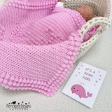 Newborn baby wrapped in a pink blanket with a 'It's a Baby Girl' card and Kerry Jayne Designs logo.