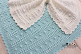 two crocheted baby blankets